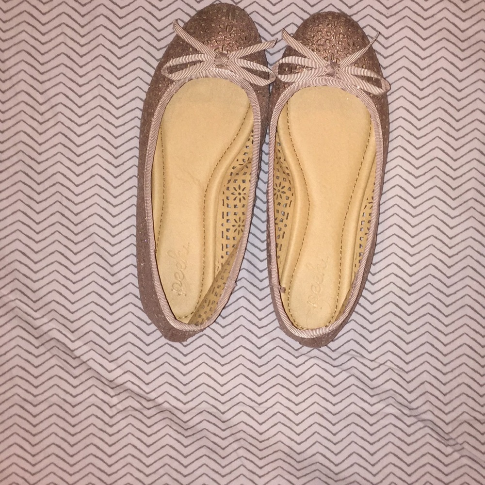 Rose gold ballerina flats.